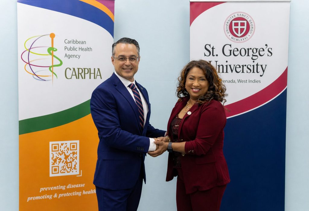 Professor Marios Loukas, President and Dean, St. George’s University and Dr. Lisa Indar, Executive Director, CARPHA following the signing of the five-year agreement.