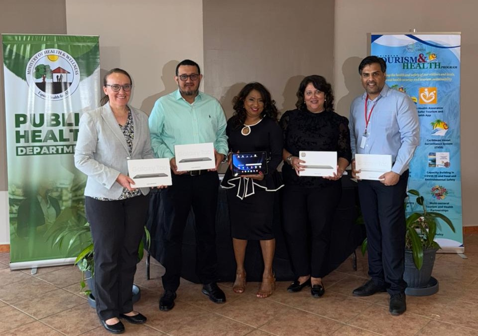 CARPHA Bolsters Belize’s Public Health Defences with Surveillance Tools, Food Safety Training and Maritime Upgrades Receiving the ten (10) data-receiving tablets laptops were (L-R) Dr. Laura Frisen, Deputy Director Health Services, Dr. Julio Sabido, CEO, MOHW and Dr. Melissa Diaz, Director of Public Health and Wellness, MOHW (2nd from right). On hand to present the tablets were Dr. Lisa Indar, CARPHA Executive Director (centre) and Mr. Keston Daniel, Coordinator, CARPHA’s Regional Tourism and Health Program.