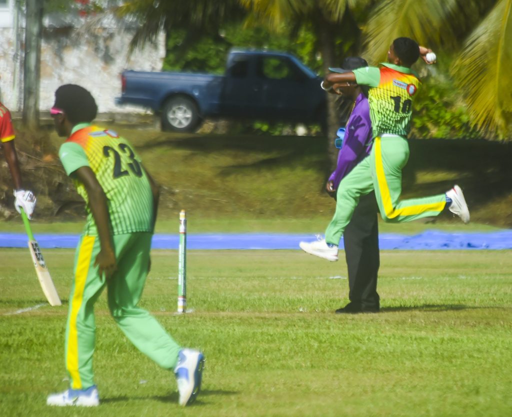 Dylan John of Dominica Under-19 jumps to bowl to a Grenada batsman during Saturday's match at the Benjamin Park (photo-: WINLOTT / Robertson S. Henry)